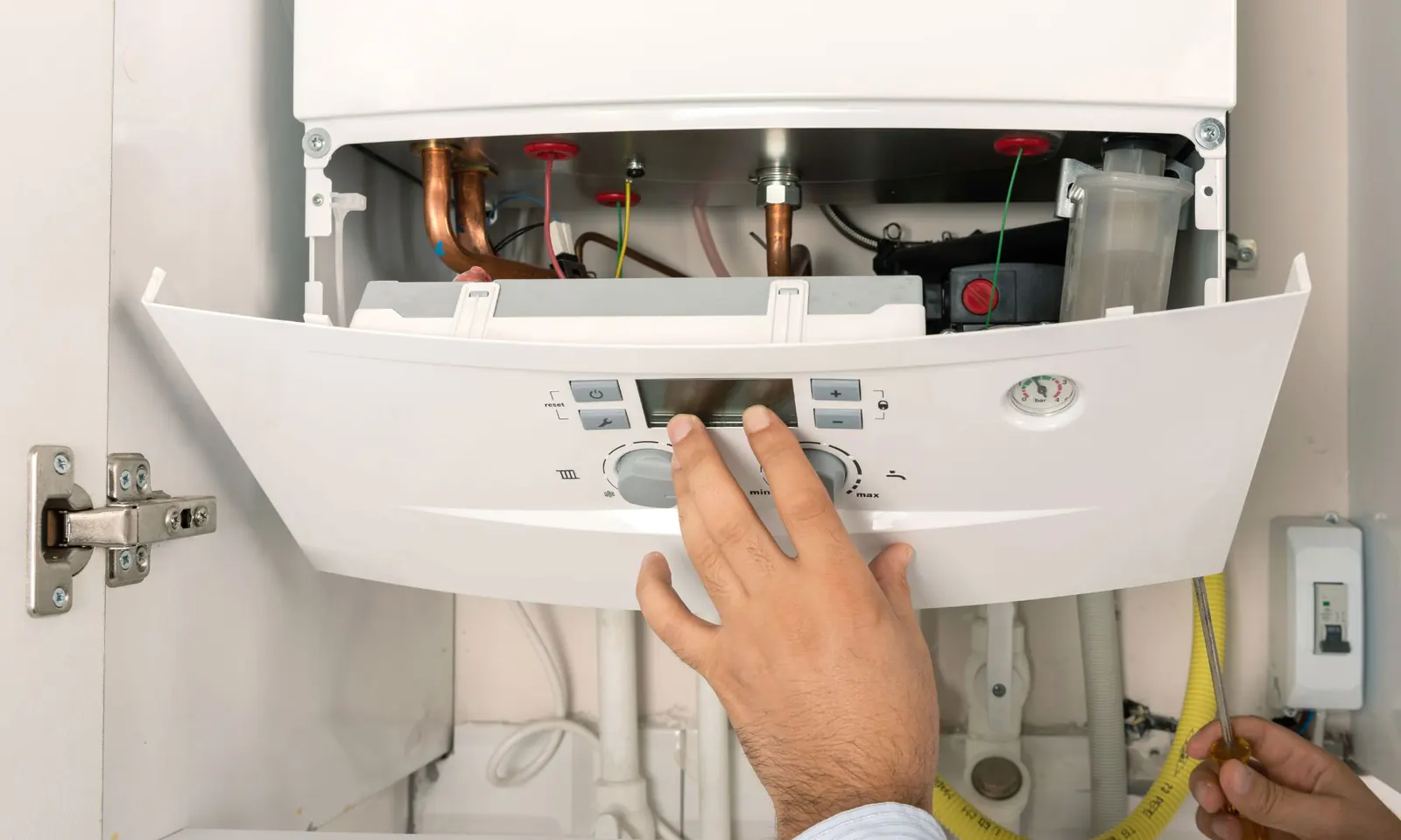Engineer carrying out an annual boiler service