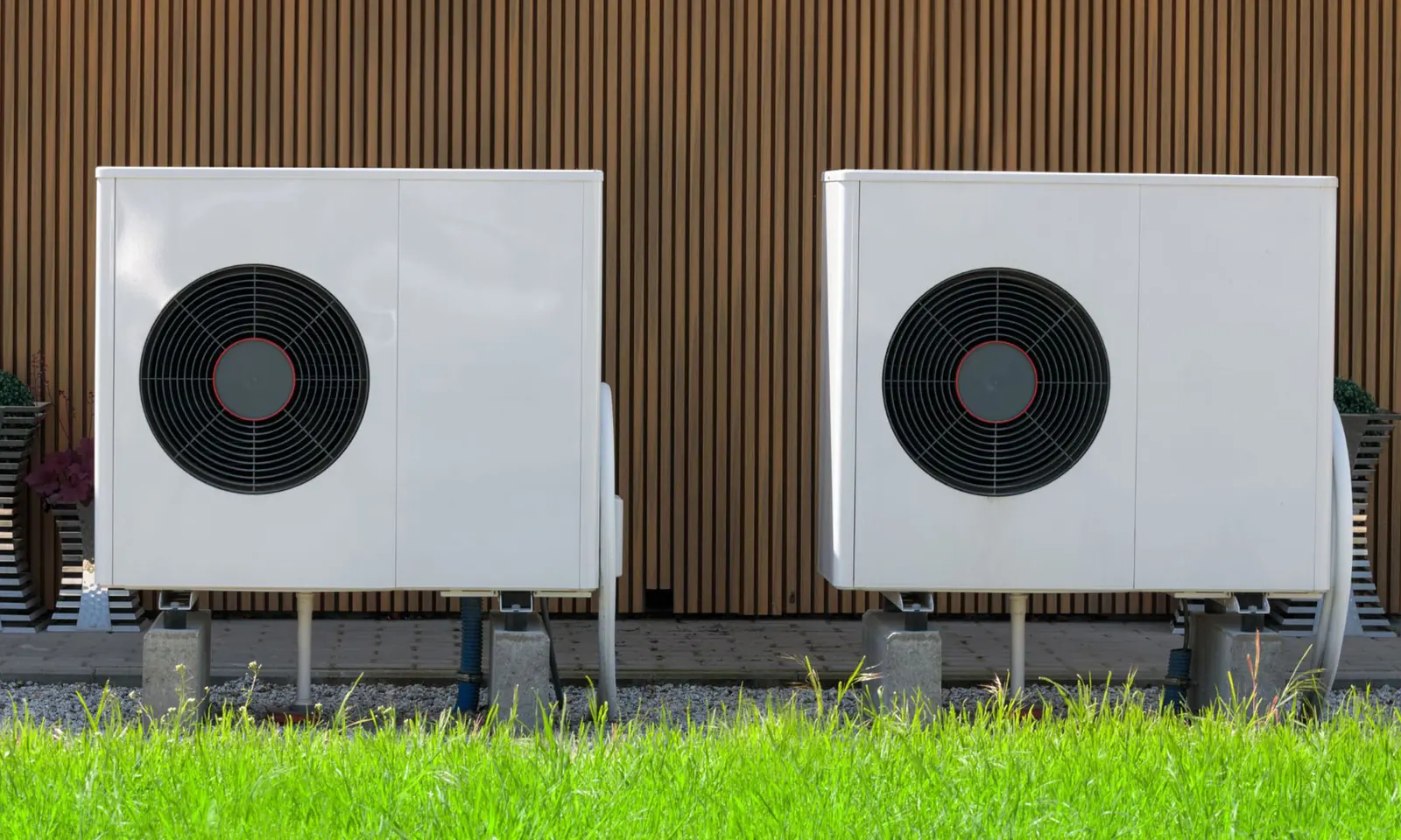 Outdoor air source heat pump unit on a house wall